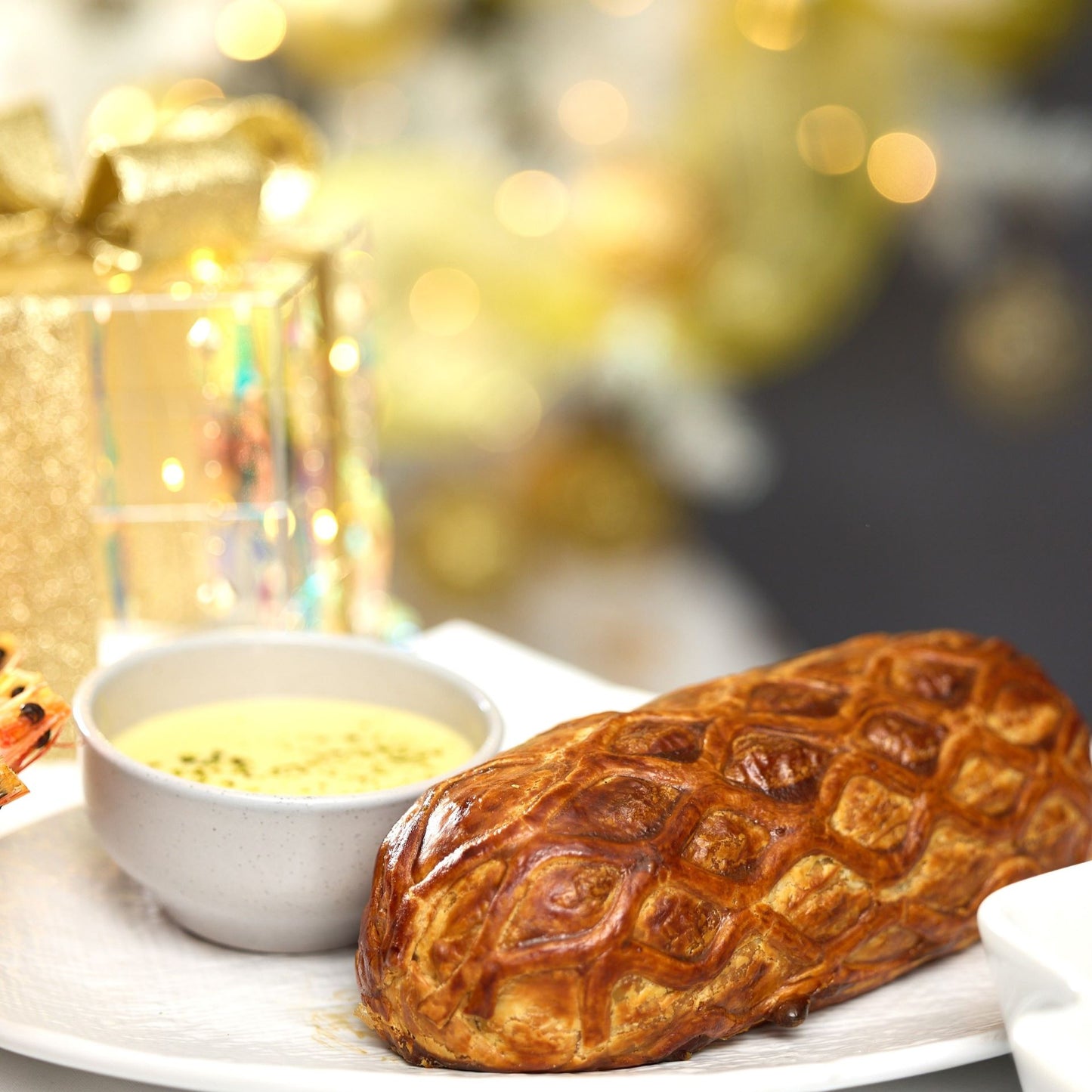 Salmon Wellington with Herb Béchamel Sauce